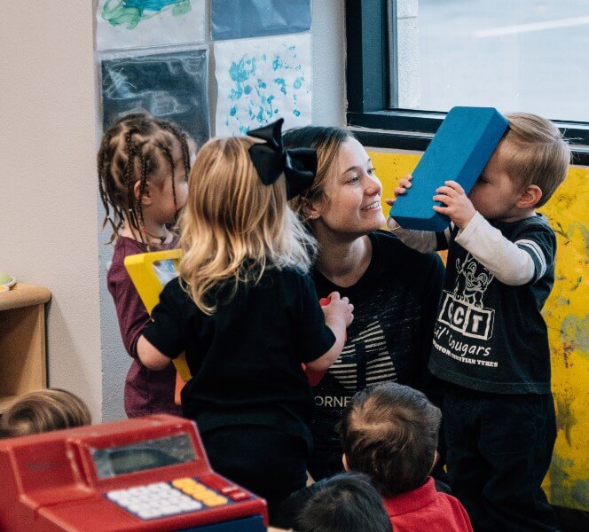 Teacher playing with kids