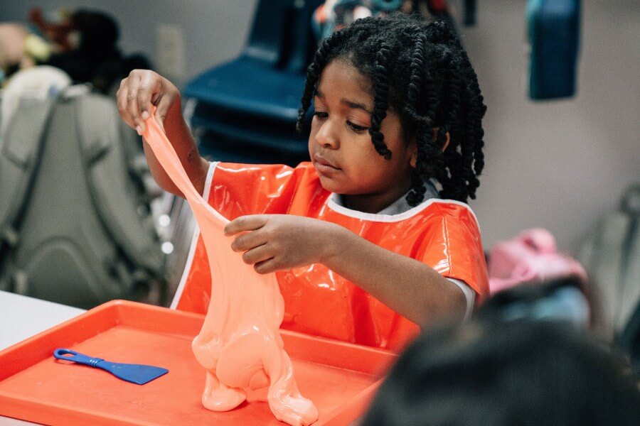 child playing with slime