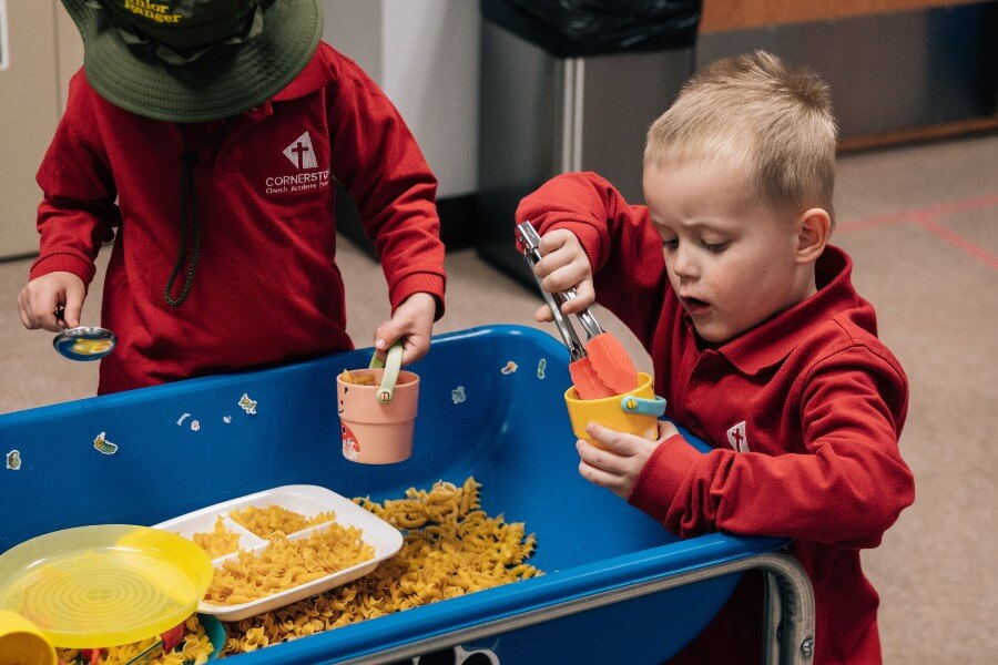 young boy playing with toys